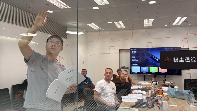 Polish engineers participating in BuilderX tele-operation training session, learning system architecture and operational workflows