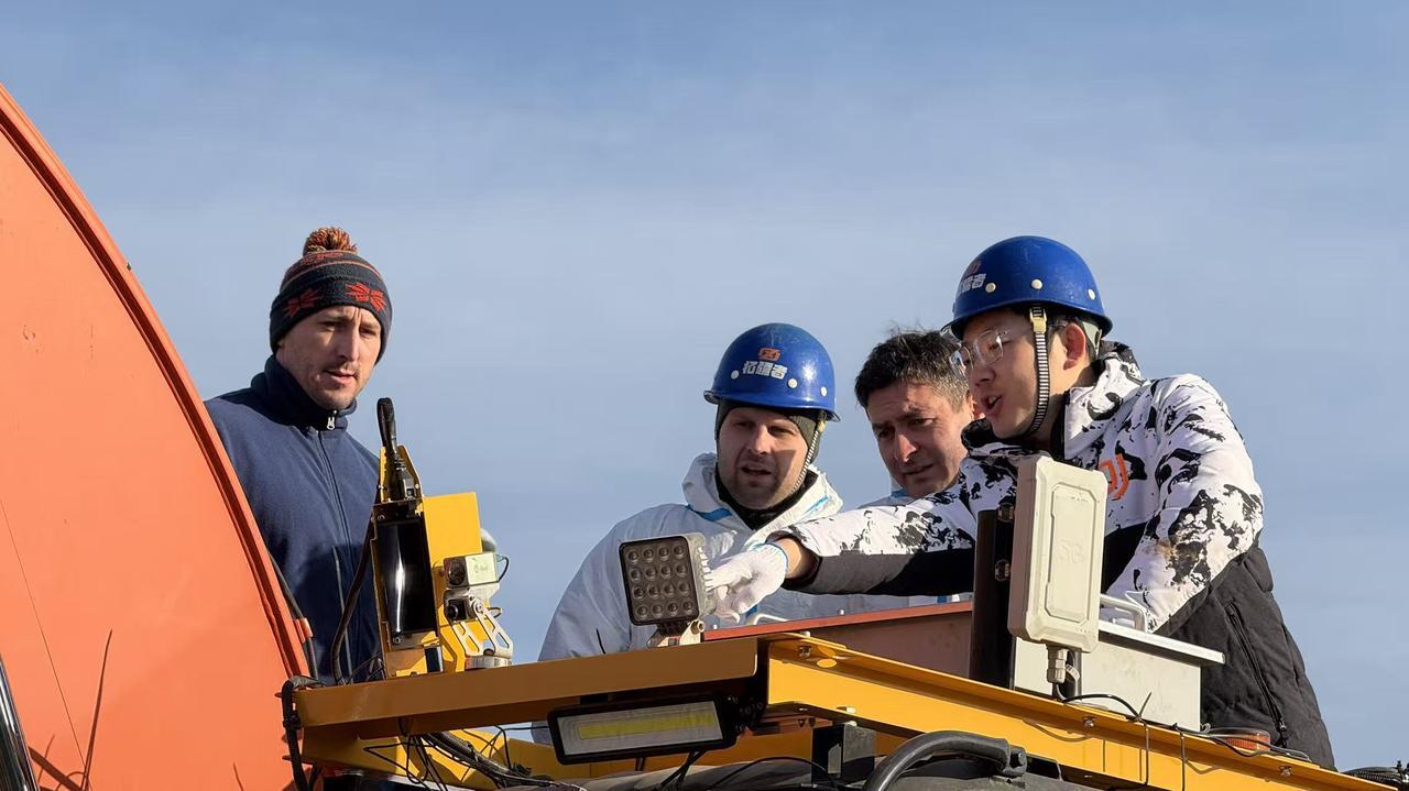 Engineers working on teleoperation retrofit system for excavator during BuilderX training program